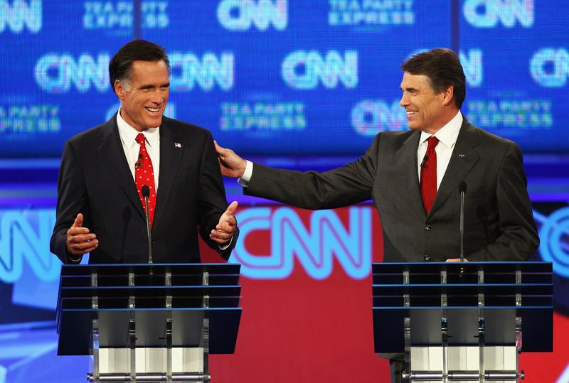 Mitt Romney and Rick Perry speak at a Republican presidential debate hosted by CNN on Monday, September 12th.